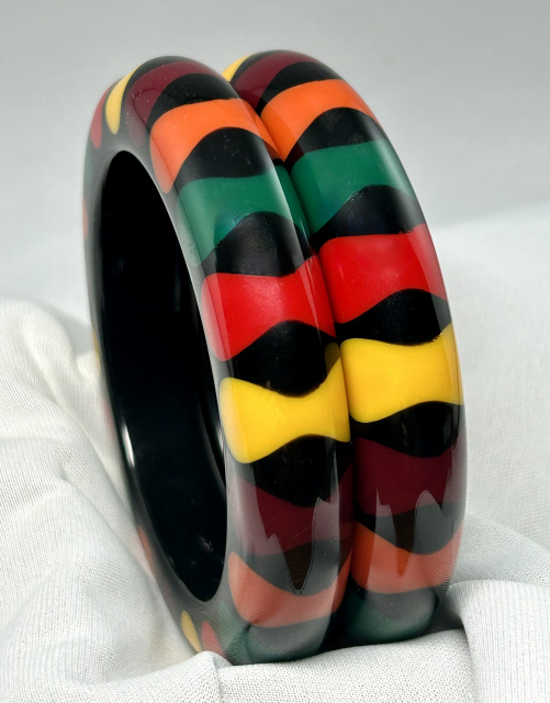 LG151 pr of black resin bangles with multicolor bowties